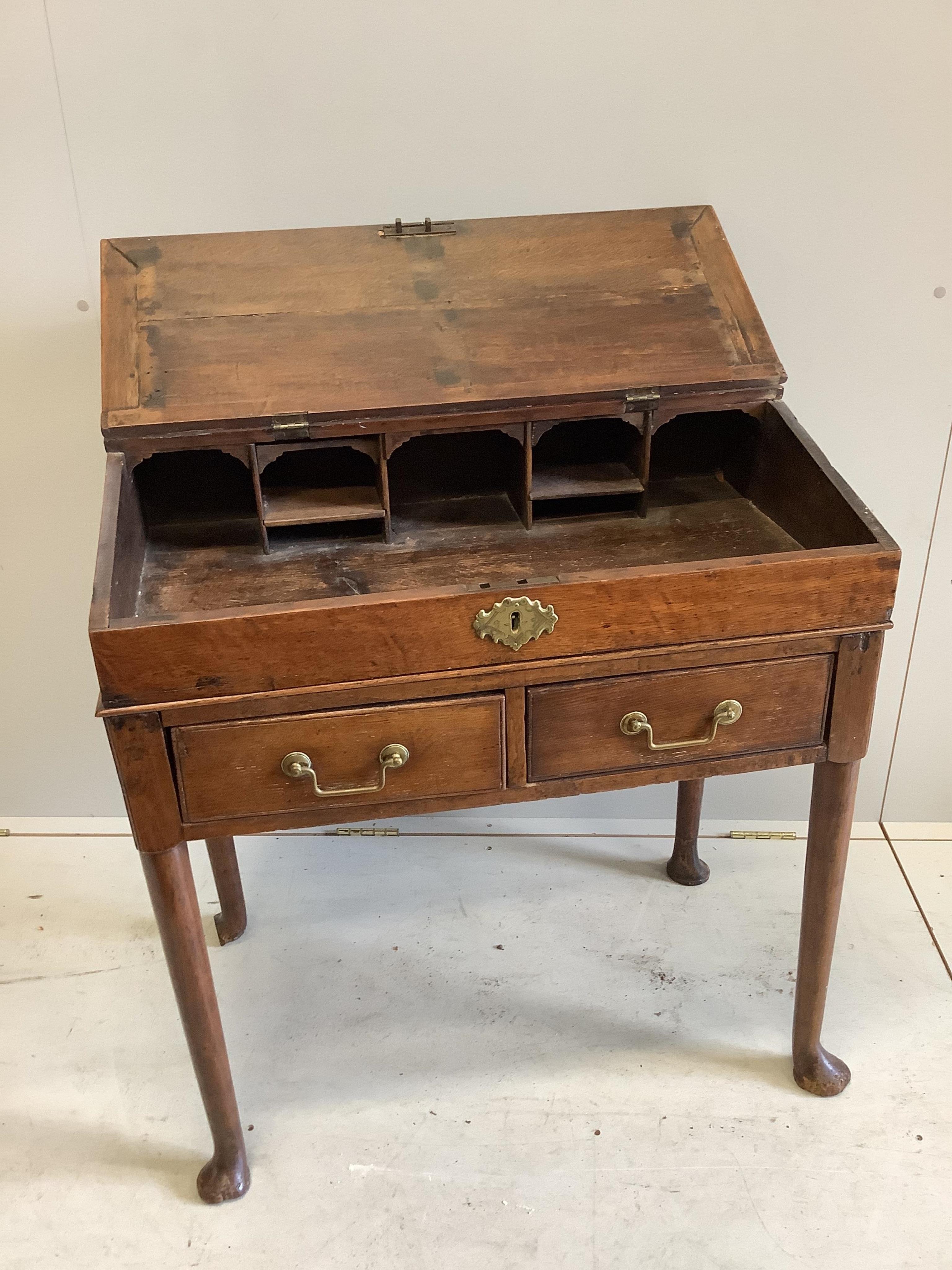 A George III oak desk, width 79cm, height 84cm. Condition - good